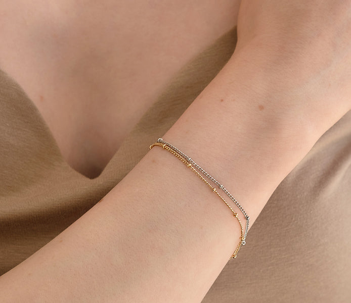 Double Bobble bracelet in gold and rhodium plating