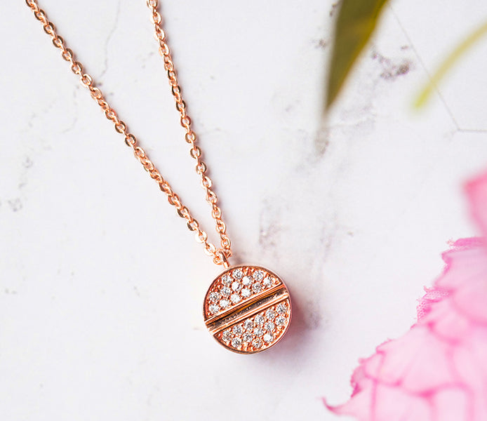 Crystal disc pendant in rose gold plating
