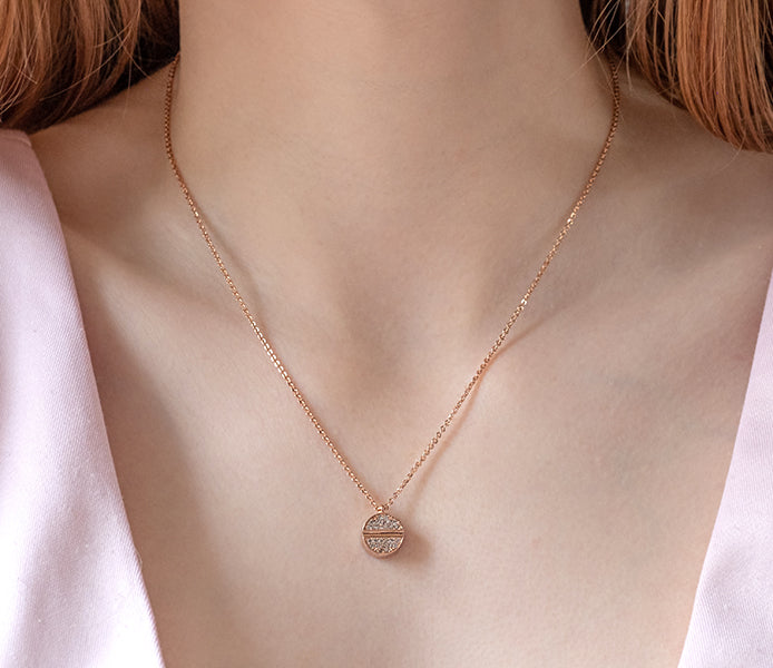 Crystal disc pendant in rose gold plating