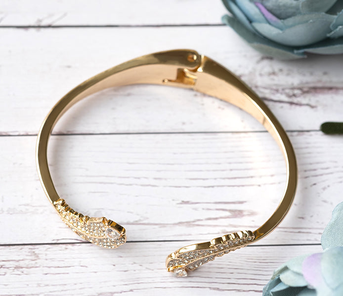Feather bangle with crystals in gold plating