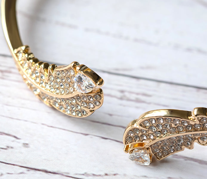 Feather bangle with crystals in gold plating