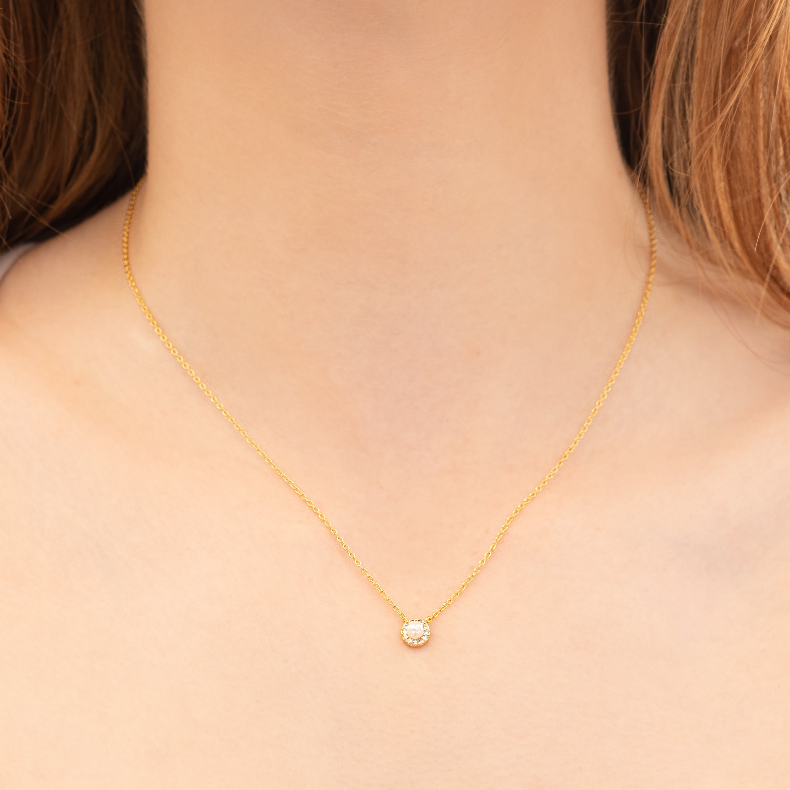 Tiny pearl pendant in gold plating